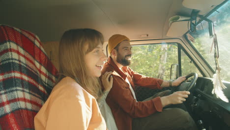 Happy-Couple-Enjoying-Road-Trip-in-Van